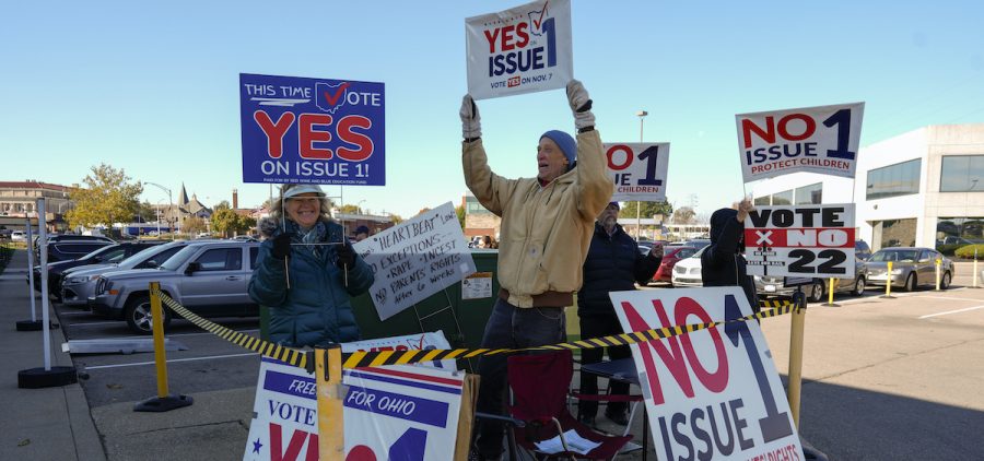 People gather in a parking lot as people arrive for early in-person voting in Cincinnati, Nov. 2, 2023. Ohio is expected to play a starring role in the 2024 high-stakes races for state supreme court seats. The Ohio Supreme Court’s 4-3 Republican majority could flip to Democrats’ favor in the fall if the party sweeps the three seats up for the election this year.