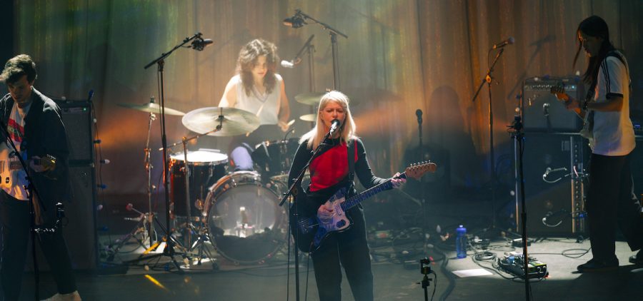 Alvvays takes the stage with Alec O'Hanley (left) on guitar, Sheridan Riely (center left) on the drumset, vocalist Molly Rankin (center), and Kerri Maclellan (right) on bass