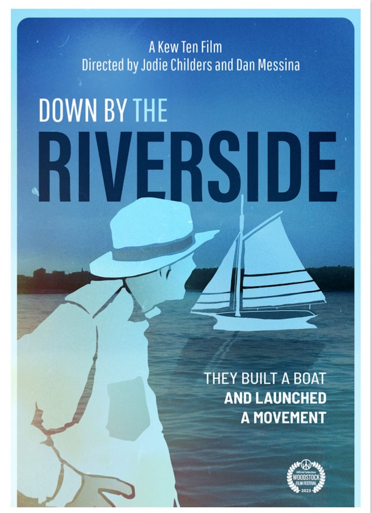An image of the poster for the film "Down by the Riverside." The poster shows the profile of a person looking out over a river. 