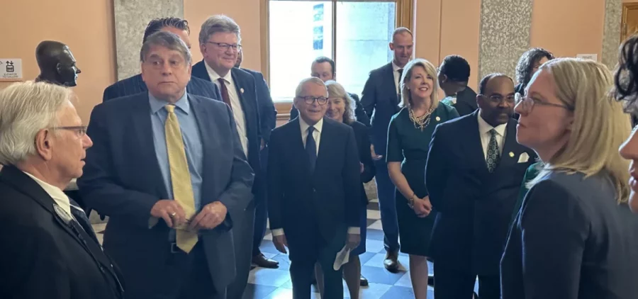 Gov. Mike DeWine (center) stands with Republican and Democratic leaders from the Ohio House and Senate outside the House chamber before his State of the State speech
