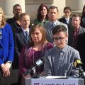 Connor Thonen-Fleck addresses reporters while his parents stand by his side