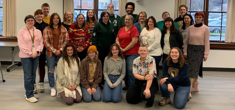 All the 2023-2024 COMCorps members stand together at their Christmas party.