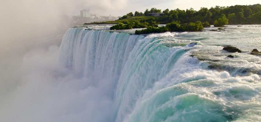 Water cascades over the crest of Niagara Falls.