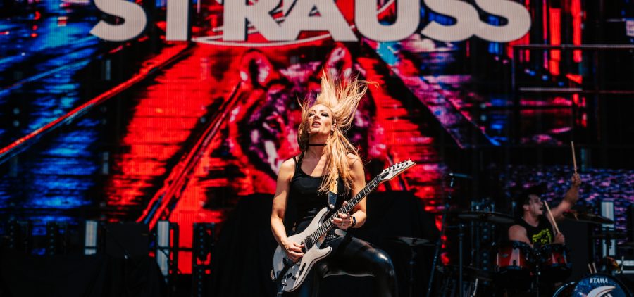 An image of guitarist Nita Strauss playing on stage at the 2024 Sonic Temple Music Festival.