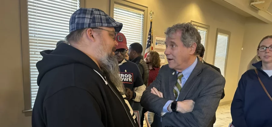 U.S. Sen. Sherrod Brown talks to a supporter at his campaign kickoff in Columbus.