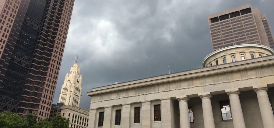 An image of a cloudy sky above a state agency