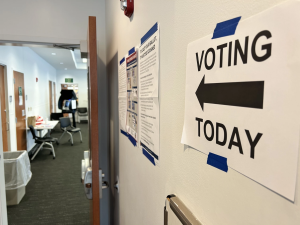 A sign directs voters to their polling location inside a library in Columbus. 