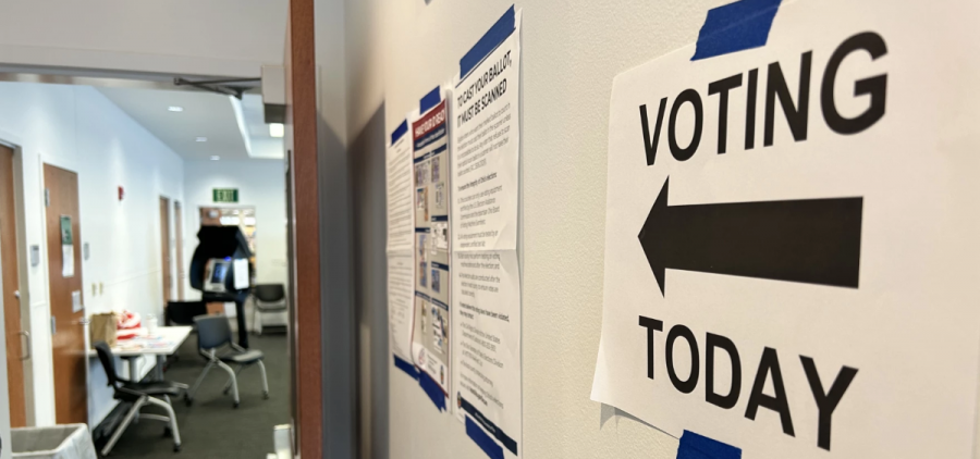 A sign directs voters to their polling location inside a library in Columbus.
