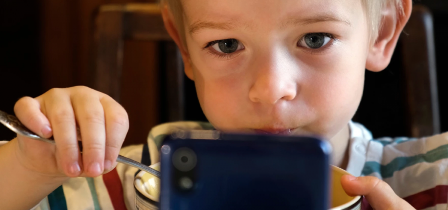 A child using a smartphone.