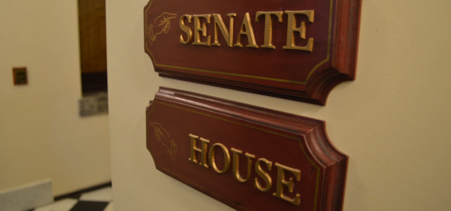 Wooden signs point to the Senate House in the Ohio capitol.