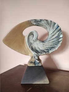 An image of the Athena Award, which is shaped like a Nautilus. 