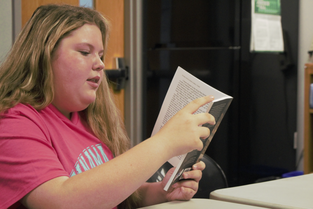 Rising seventh grader Briley Mash reads from her essay in the book Young Voices from a Small Town.