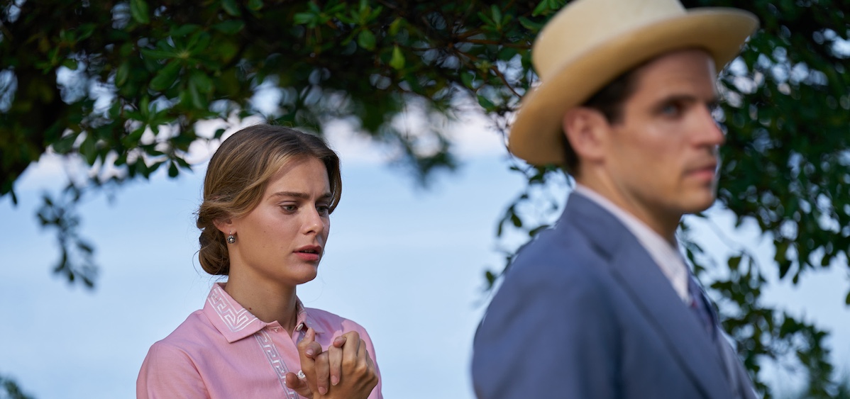 Constance March - HOTEL PORTOFINO (Season 3) hands clutched, male character with hat out of focus and walking away