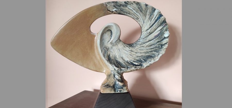 An image of the Athena Award, which is shaped like a Nautilus.