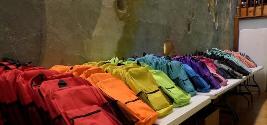 Free school backpacks at a giveaway event in Athens.