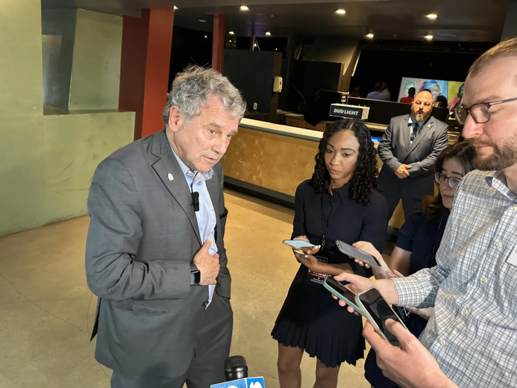 U.S. Senator Sherrod Brown talks to reporters.