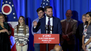 JD Vance, the recently announced Trump VP pick, speaks at a podium after his senate election win.