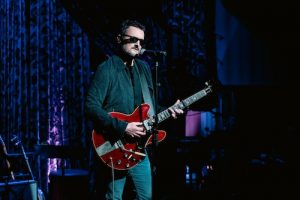 Eric Church playing guitar on stage