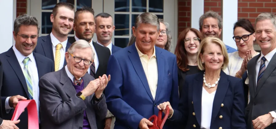 Sen. Joe Manchin (I-West Virginia), accompanied by Sen. Shelly Moore Capito (R-West Virginia) to his right and West Virginia University President Gordon Gee (left of Manchin) cut the ribbon on the ARCH2 hydrogen hub in Morgantown, West Virginia