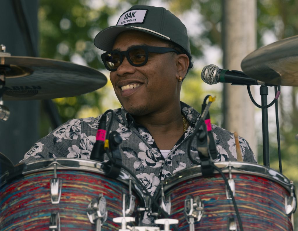 The Sensational Barne's Brothers' drummer grins as he provides top notch beats for the Nelsonville Music Festival.