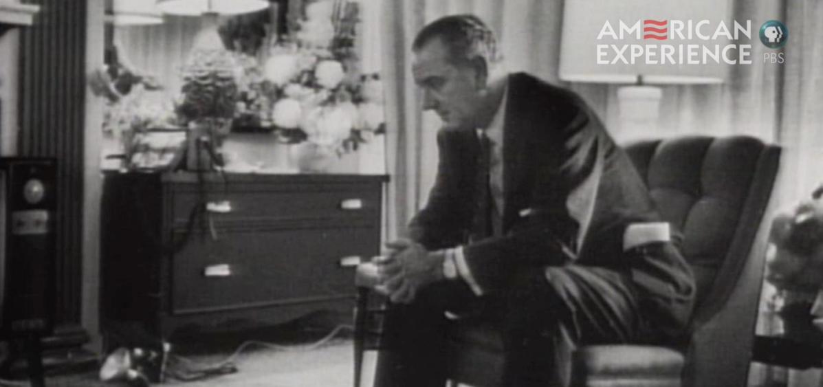 LBJ leaning on knees in oval office