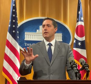 Ohio Secretary of State Frank LaRose speaks at a podium.