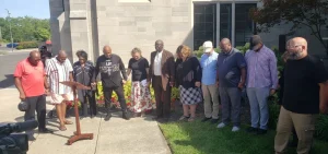 Springfield community and faith leaders prayed together outside of a church.