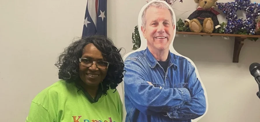 Venita Shoulders poses with a cardboard cutout of Sherrod Brown.