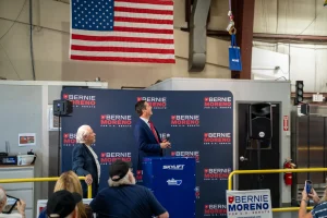 Nick Jarmoszuk presents U.S. Senate Candidate Bernie Moreno with a gift via one of his Skylift digger derricks, manufactured in Lorain.