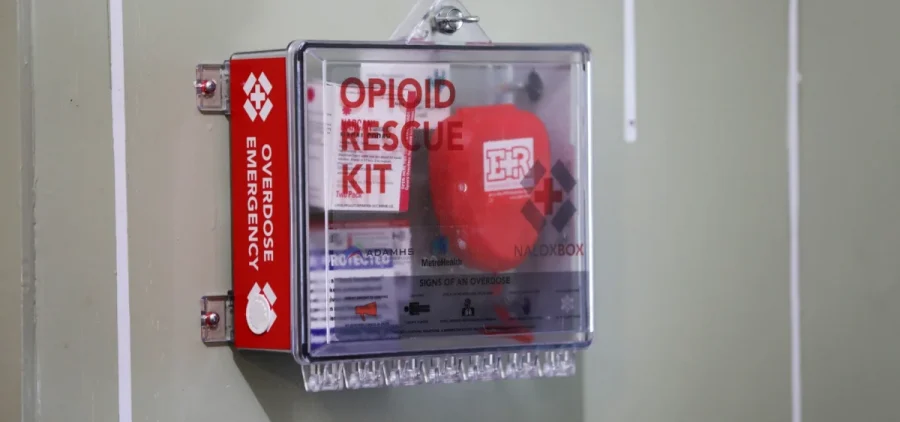 An Opioid Rescue Kit sits on a wall