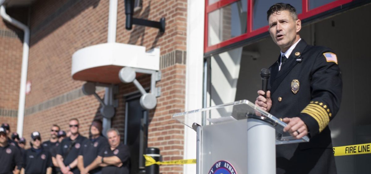 Athens Fire Chief Bob Rymer addresses a crowd at the ribbon-cutting ceremony for the new fire station.