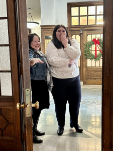 Emilee Mulhall reacts as she discovers the meeting she thought she was attending with her supervisor, Michelle Shaver, was really a setup to present her with an award to pay off her student loan debt.