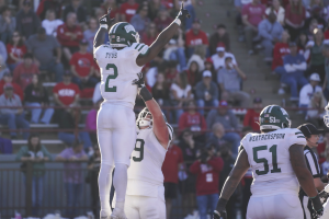 Anthony Tyus III is lifted after scoring on Ohio's first drive in the second half.