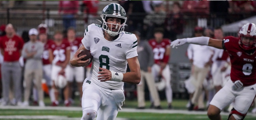 Ohio quarterback Nick Poulos scrambles vs Miami.