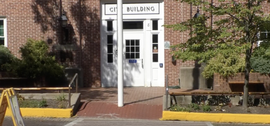A crosswalk made with brick-stamped concrete in front of Athens City Hall