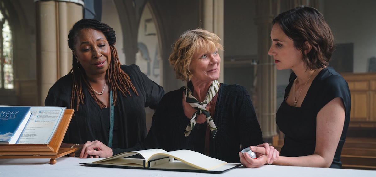 Three femaie actors in THE MARLOW MURDER CLUB. Shown L-R: Suzie Harris (Jo Martin), Judith Potts (Samantha Bond), Becks Starling (Cara Horgan) Courtesy of MASTERPIECE, Monumental Television, and UKTV.