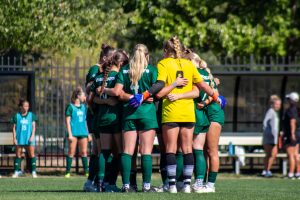 Ohio huddles before beginning playing Marshall.