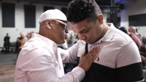 Moment from Rev Gabriel Salguero’s church, The Gathering, in Orlando, FL.. Man laying hand on another chest in prayer Credit: Bernardo Ruiz