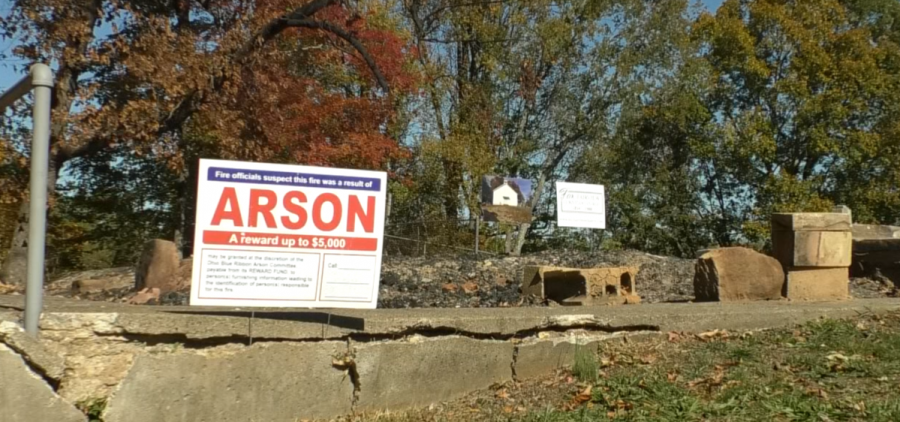 A sign that says arson is in the ashes of the Fox Fairview Church in Gallia County.