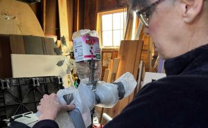 A scarecrow is constructed for a trail display.