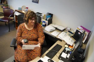 Julie Leathers Stahl, director of the Wayne County Board of Elections, scans and verifies absentee ballots received in the mail at the agency's headquarters