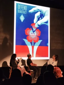 Colleen Halston, CEO and artistic director of Artworks, left, moderates a conversation with artist and activist Shepard Fairey, and Cincinnati artist Jeni Jenkins at the Contemporary Arts Center in Cincinnati.