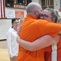 Buckeye setter Megan Booth hugs Head Coach Wayne Dicken