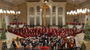 wide shot of orchestra, chorus in large church setting