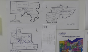 Maps of Meigs, Washington and Athens Counties are pinned to Kevin Ritter's office wall. Four X's are on the Athens map. The X's signify Ohio House District 95's coverage area. 