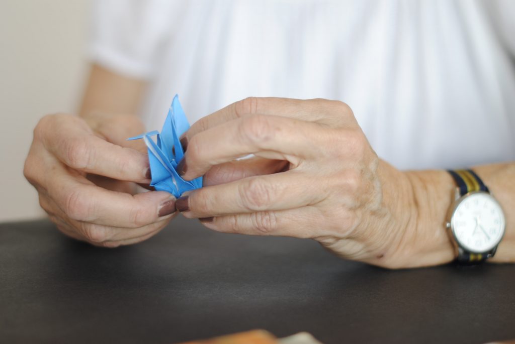 An image of someone making origami out of paper.