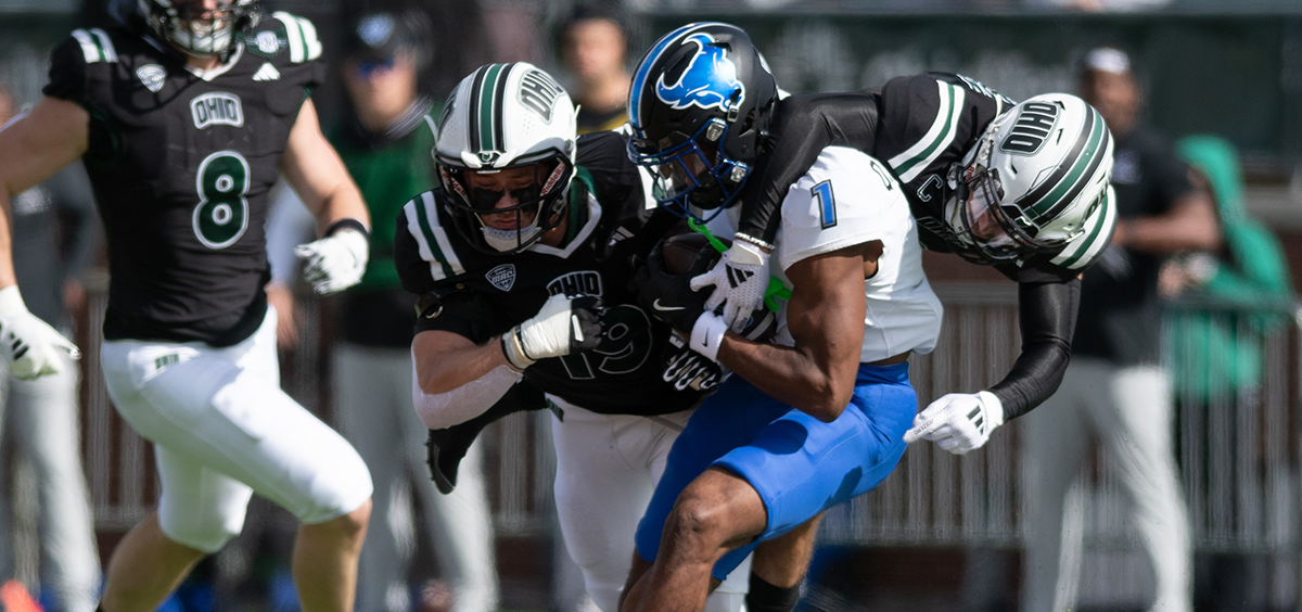 Ohio's defense collides with Buffalo's quarterback C.J. Ogbonna.