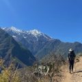 An image of Christopher Fiorello walking on a mountainside.