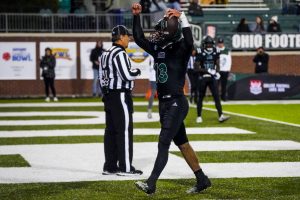 Parker Navarro celebrating after scoring one of his four rushing TDs against Eastern Michigan. 