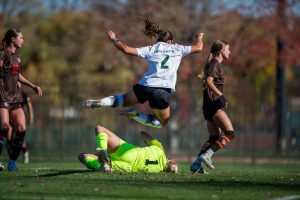 Ohio's Ella Deevers (#2) dives over Bowling Green's goalie. 